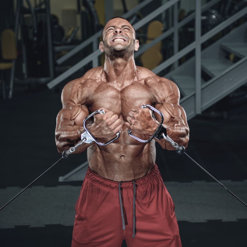Muscular man doing chest fly for Superior Shredz